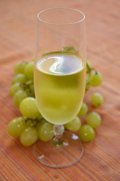 istock white wine and bunch of grapes 1068272042