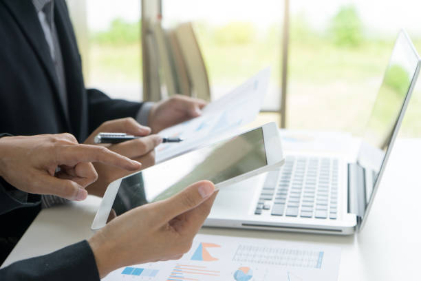 istock Business businessman work on the table use computer and tablet 1068273206