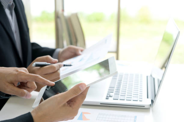 istock Business businessman work on the table use computer and tablet 1068273230