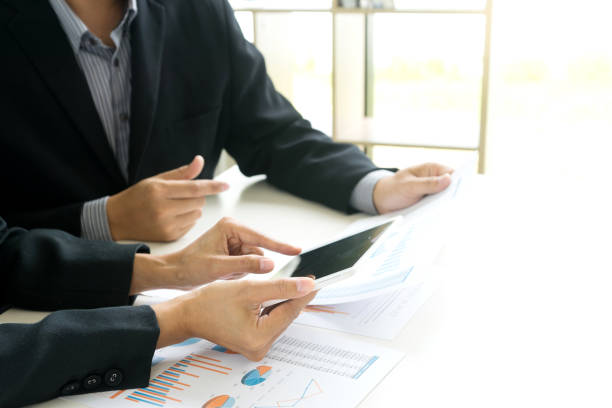 istock Business businessman work on the table use computer and tablet 1068273238
