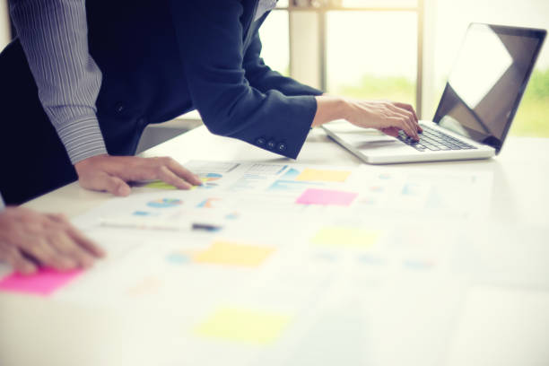 istock Business businessman work on the table use computer and tablet 1068273304