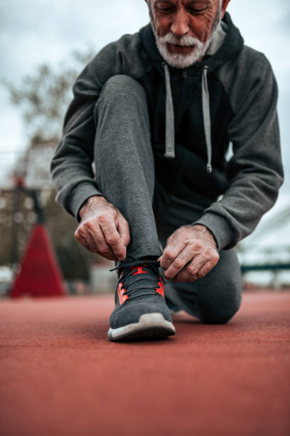 istock Preparing for a run on outdoor stadium. Close-up. 1068274512