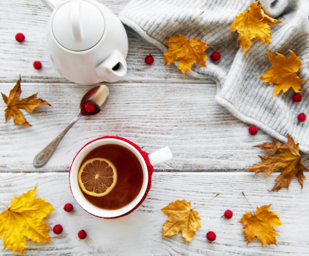 istock autumn flat lay with cup of tea and leaves 1068275872