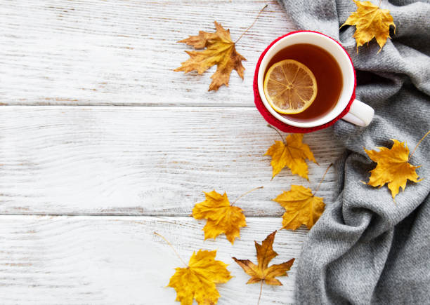istock autumn flat lay with cup of tea and leaves 1068275984