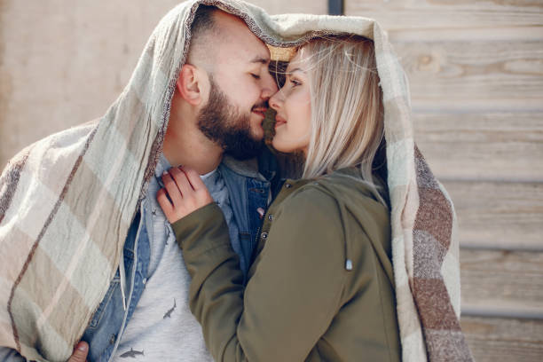 istock Elegant couple in a winter park 1068285542