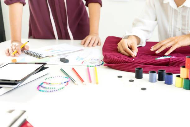 istock professional Fashion designer working and drawing sketches 1068289816
