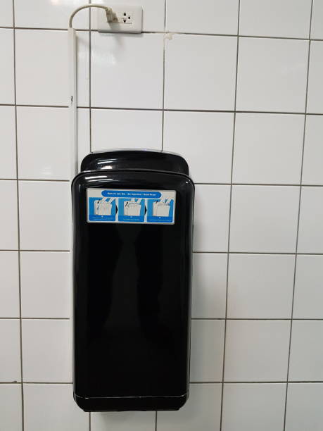 istock Automatic bathroom hand dryer in public toilet 1068298906