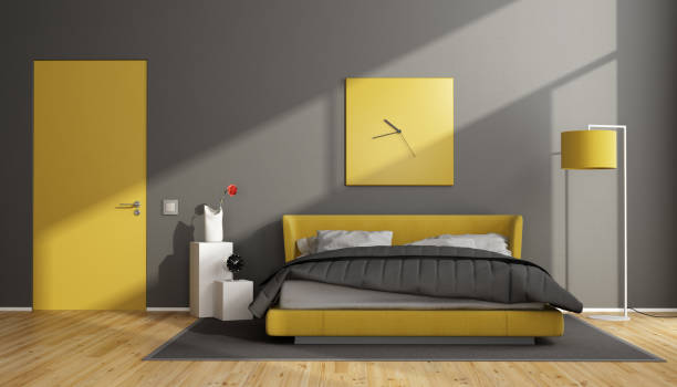 istock Gray and yellow modern bedroom 1068303100