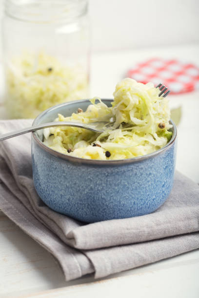 istock Sauerkraut in a blue bowl on a wooden table 1068303710