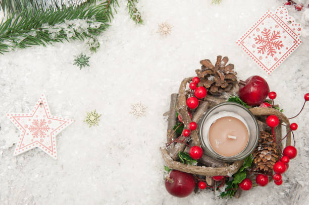 istock Christmas background with artificial snow, candle and Christmas tree branches. Top view 1068308412