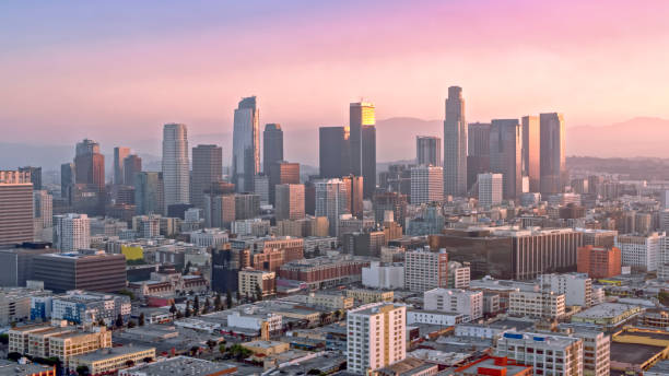 Aerial view of cityscape of Los Angeles shining at sunrise Aerial view of the city shining in the morning sun, Los Angeles, California, USA. los angeles county stock pictures, royalty-free photos & images