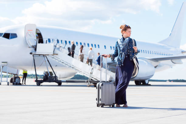 istock Beautiful woman disembarking the flight 1068312734