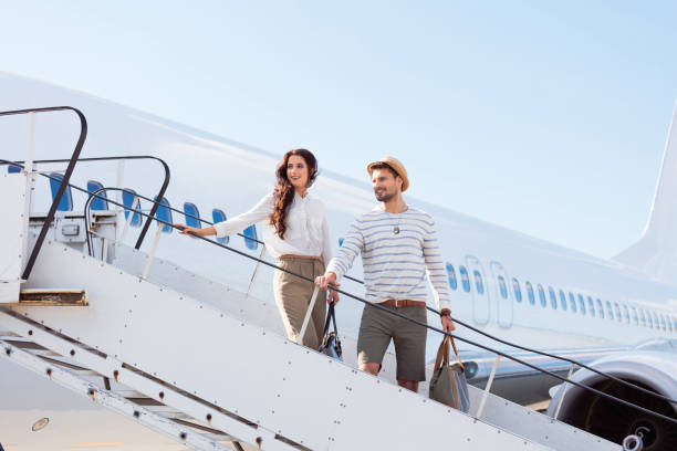 istock Beautiful couple boarding a flight 1068313510