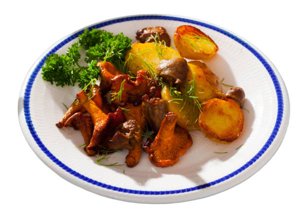 istock Fried chanterelles with chicken hearts and potatoes 1068321894