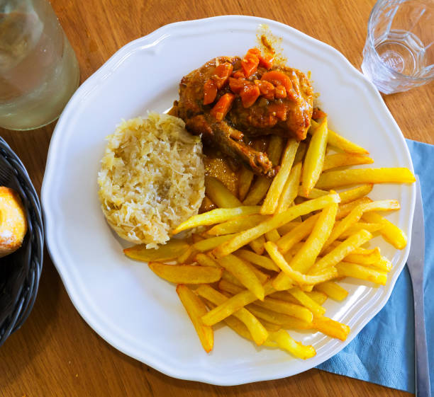 istock Fried potatoes, sauerkraut, stewed chicken 1068322514