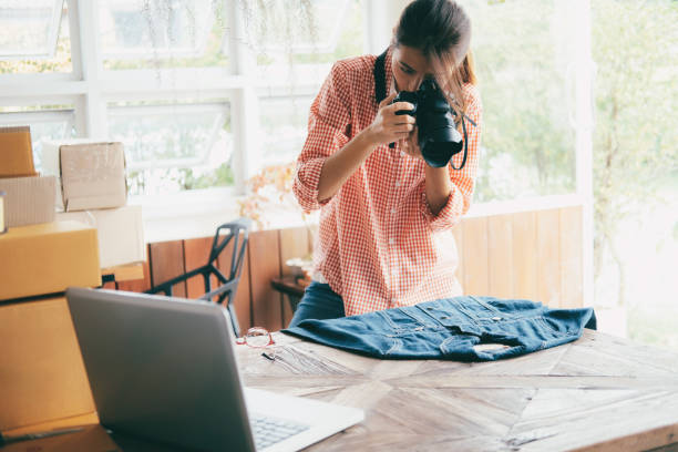 Online seller take a photo of product for upload to website. Online seller owner take a photo of product for upload to website online shop. Online Selling , Online Shopping and e-Commerce concept. market vendor photos stock pictures, royalty-free photos & images