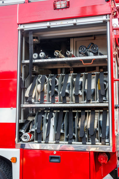 istock Rescue fire truck equipment. Compartment of the rolled up fire hoses on a fire engine 1068325842