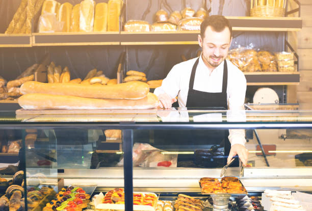 istock Man shows the delicious pastries and cakes 1068332046