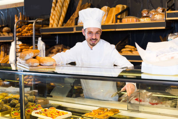 istock Young man seller is demonstrating assortment 1068332100