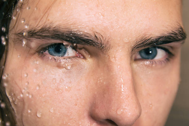 istock Sexy guy washes in the shower. 1068333110