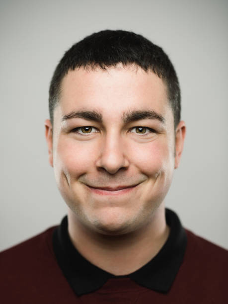 istock Portrait of a real young caucassian man smiling at camera. 1068333262