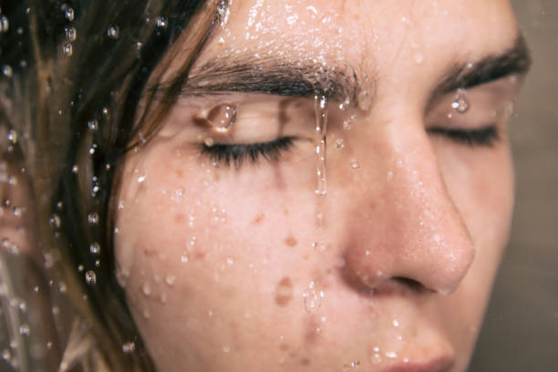 istock Sexy guy washes in the shower. 1068333268