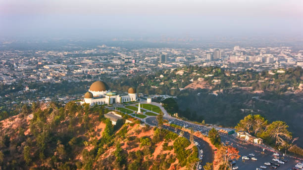 Aerial view of Griffith Observatory overlooking the city of Los Angeles in the morning sun Aerial view of the Griffith Observatory sitting on the Mount Hollywood and overlooking the city of Los Angeles in the morning sun, California, USA. griffith park observatory stock pictures, royalty-free photos & images