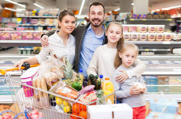 istock Modern children and parents with purchases 1068334946