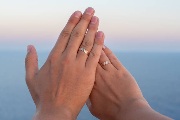 istock Bicolor wedding rings on the sunset 1068341078