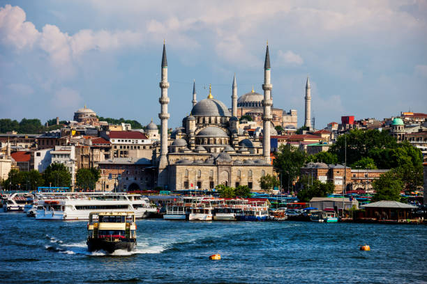 Istanbul, Turkey - November 6, 2012: A view from Galata Bridge Traditional fish restaurant by the sea and the Suleymaniye Mosque in the background, Istanbul