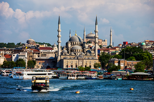Turkey, Istanbul, city skyline with New Mosque seen from Golden Horn, Eminonu district.