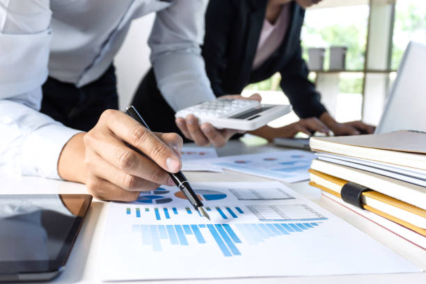 istock Group of coworkers work together office, business making conversation with partner presentation project at meeting working and analysis, Idea presentation and strategy plan of business investment 1068343140
