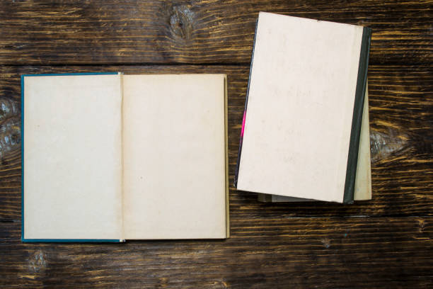 istock Old books on wooden background. 1068349824