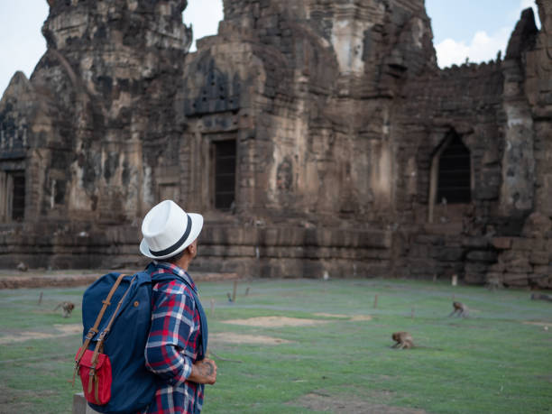 istock Senior man Asian with backpack are walking at Phra Prang Sam Yot. Ancient and historical attractions and one of the most important archaeology of Lopburi province thailand. Travel, Tourist Concept 1068350302