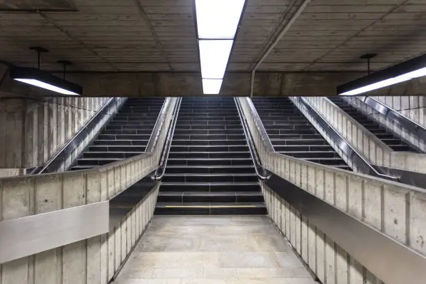 Photo of Concrete stairs leading out of underground train station