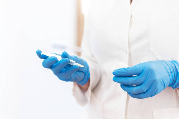 istock Female doctor with fillesr in hand 1068355966