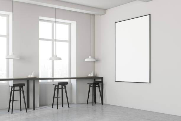 istock White cafe with black stools and poster 1068359412