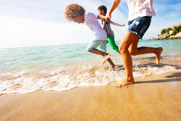 istock Happy kids having fun at the seaside in summer 1068363004