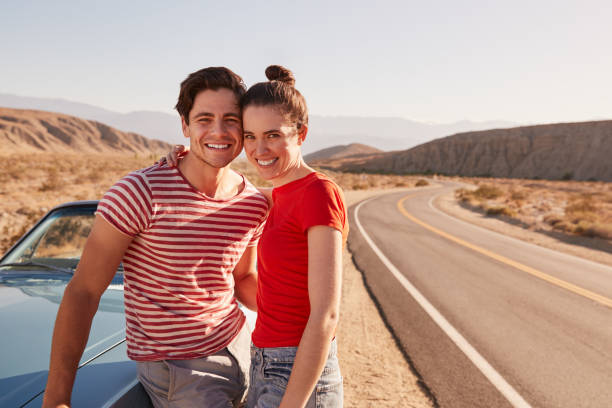 istock Young white couple on a road trip break looking to camera 1068365406