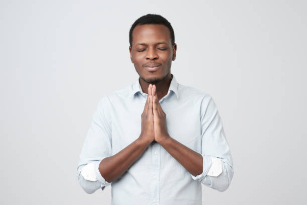 istock African young guy asking for a favor. Please cover me at work. 1068369670