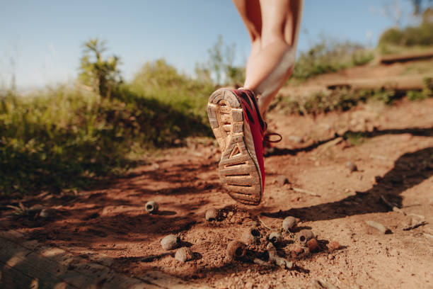 istock Cropped shot of an athlete walking on a mud trail path 1068369780