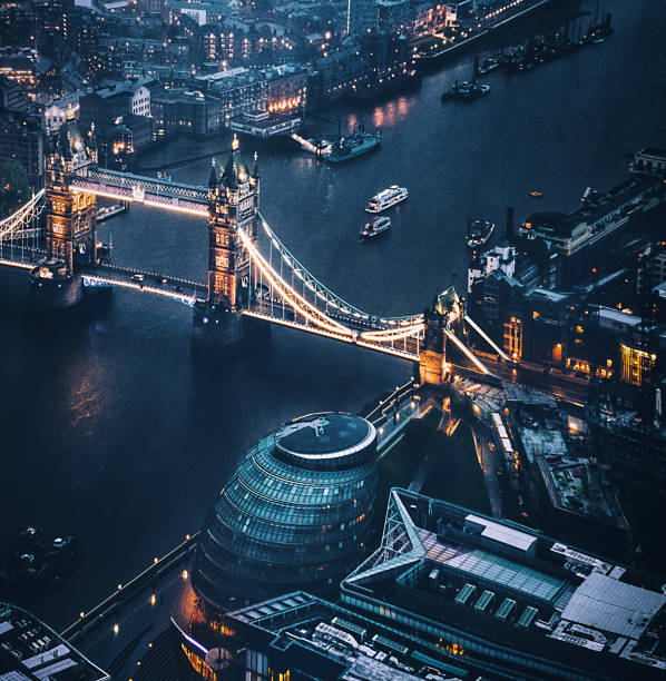 tower bridge aerial view at night tower bridge aerial view at night overhead light stock pictures, royalty-free photos & images