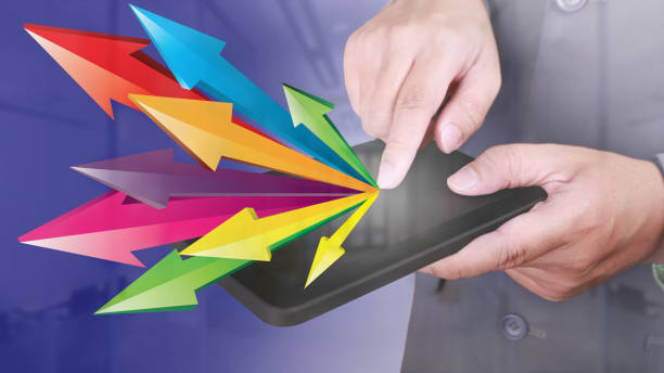 istock Businessman Click PC Tablet with Arrows Spreading. Launching Sharing in Business Concept 1068380144