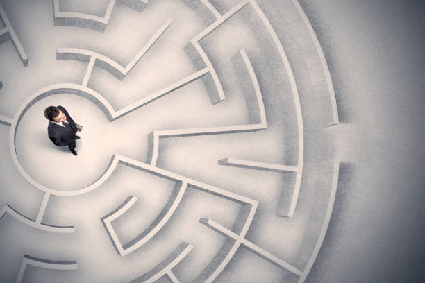 istock Business man trapped in a circular maze 1068381138