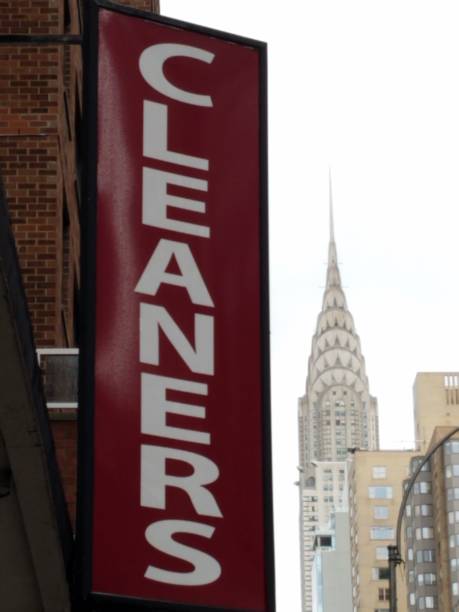 Cityscape - cleaners sign and skyscraper