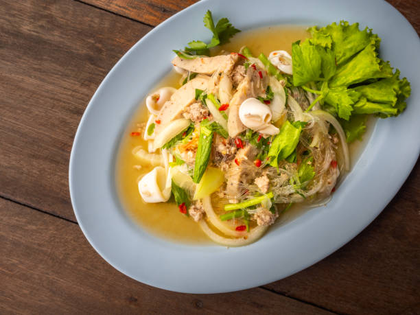 istock Sour & spicy vermicelli salad with squids 1068384938