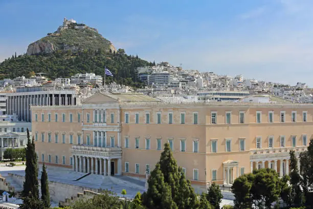Government Building Hellenic Parliament in Athens Greece and Mount Lycabettus