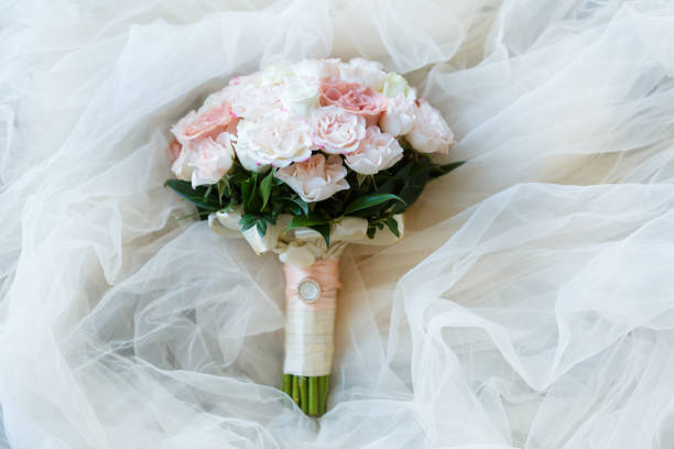 istock Sweet bride bouquet with beautiful fresh roses 1068391034