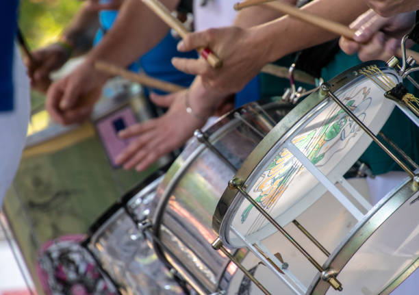 istock Midsection Of Musicians Playing Drums During Concert 1068398338