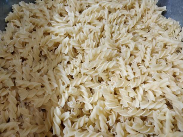 istock Colorful raw Penne Rigate noodles pasta 1068400818